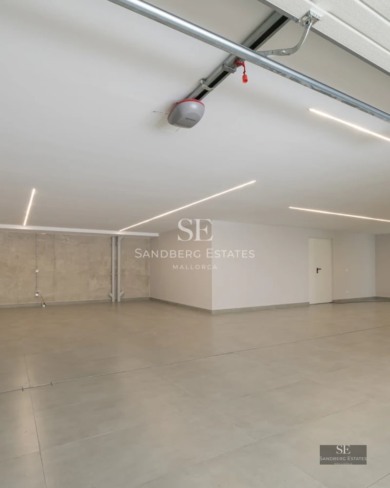 Exterior view of a modern villa with a pool, large windows, and minimalist design. Landscaping details and high-quality finishes.