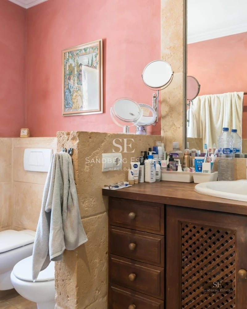 Exterior of a modern villa with a pool, minimalist design, large windows, and manicured landscaping.