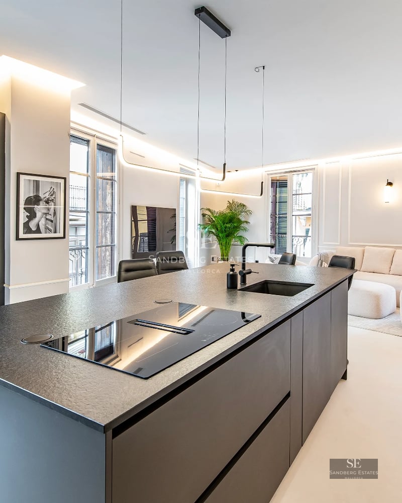 Exterior of a modern villa featuring an infinity pool, manicured garden, and minimalist architecture. Soft evening light.