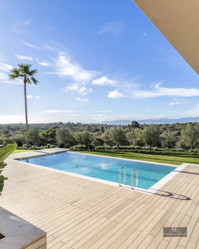 Expansive terrace featuring an infinity pool with panoramic sea views. Modern design with sun loungers and luxurious details.