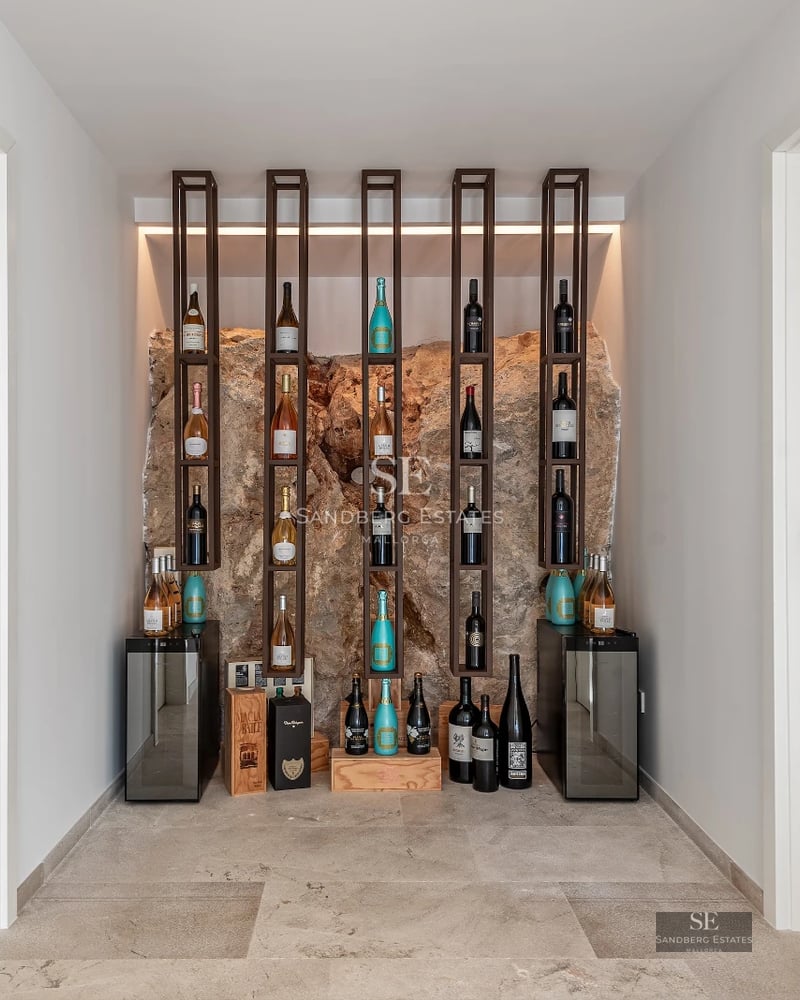 Expansive terrace with infinity pool, sun loungers, and panoramic views. Modern, elegant design ideal for relaxation.