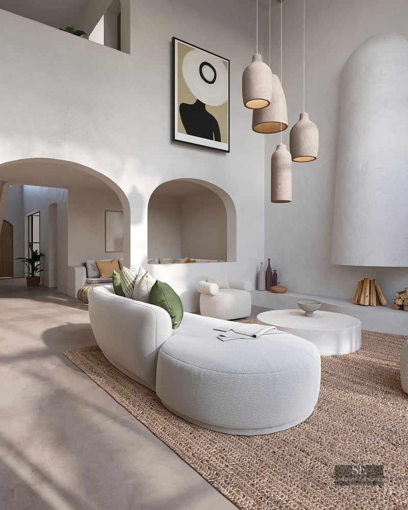 Elegant white living room featuring curved bouclé sofas, a sculptural fireplace, and textured plaster arches.