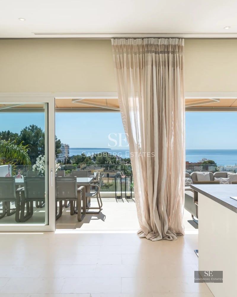 Spacious terrace with infinity pool, panoramic views, and modern furniture. Elegant exterior design with abundant natural light.