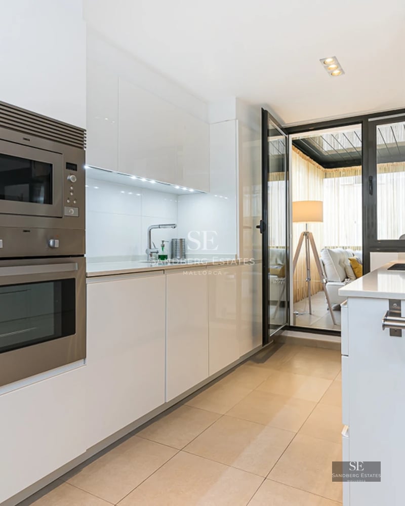 Panoramic view of a modern villa featuring an infinity pool, lush garden, and minimalist architecture. Open spaces and abundant natural light.