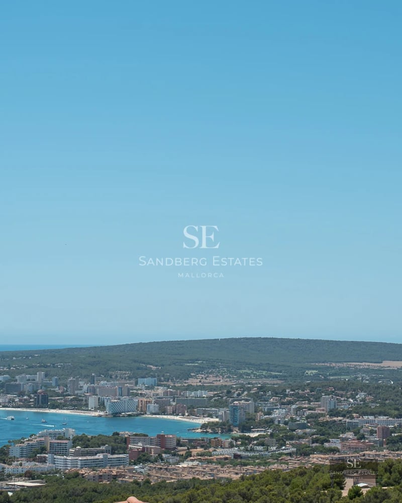 Spacious balcony with panoramic sea views. Modern design with outdoor furniture and glass railing. Bright and elegant.