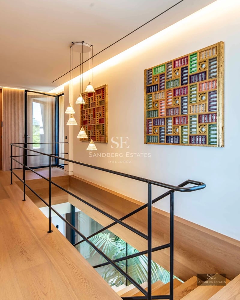Image of a modern villa with a pool. Minimalist architecture, large windows, reflective pool and lush vegetation.