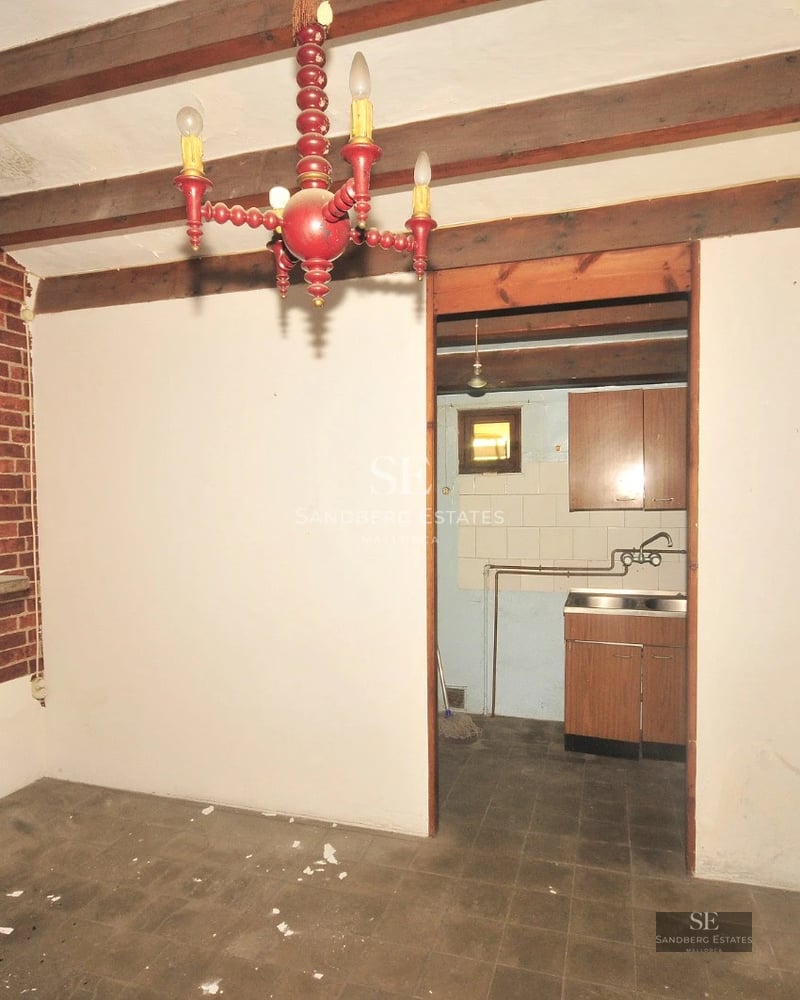 Spacious balcony with panoramic sea views. Glass railing, wooden floor, modern and elegant furniture.