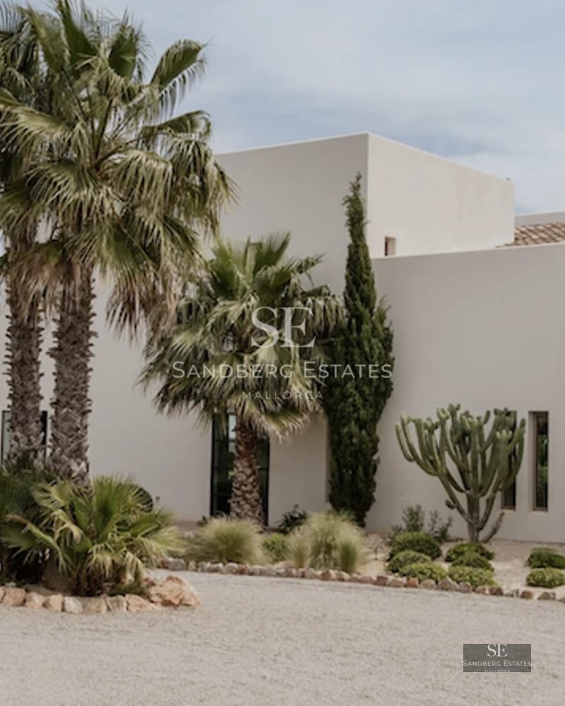 Spacious balcony with sea view. Modern outdoor furniture, wooden floor. Bright and elegant space.