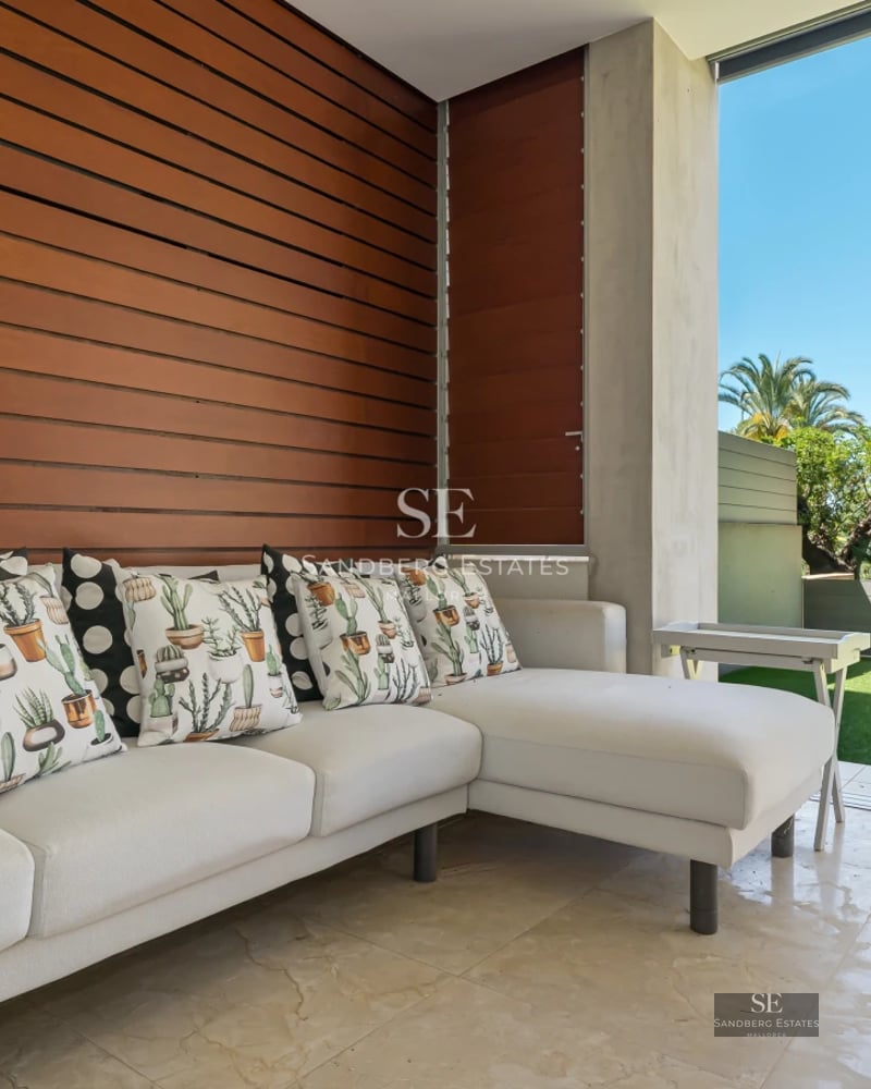 Exterior view of a modern villa with infinity pool. Clean architecture, spacious terraces and lush greenery. Luxury and comfort.