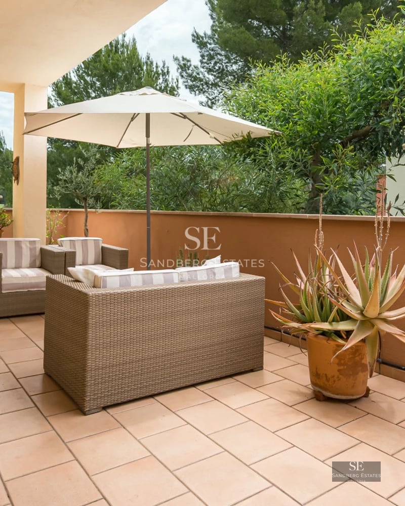 Aerial view of modern villa featuring infinity pool, spacious terraces, minimalist design, and lush gardens. High-quality finishes.