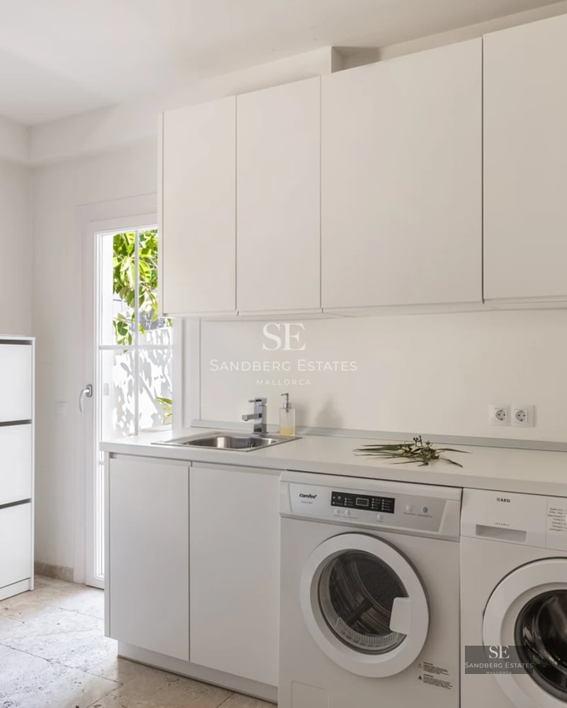 Spacious balcony with panoramic sea views. Modern design, glass railing, and stylish furniture. Soft ambient lighting.