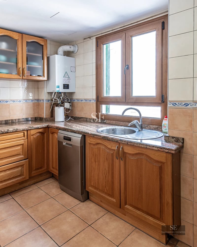 Exterior view of a modern villa with pool, surrounded by greenery. Minimalist architecture, large windows and sunny terraces.