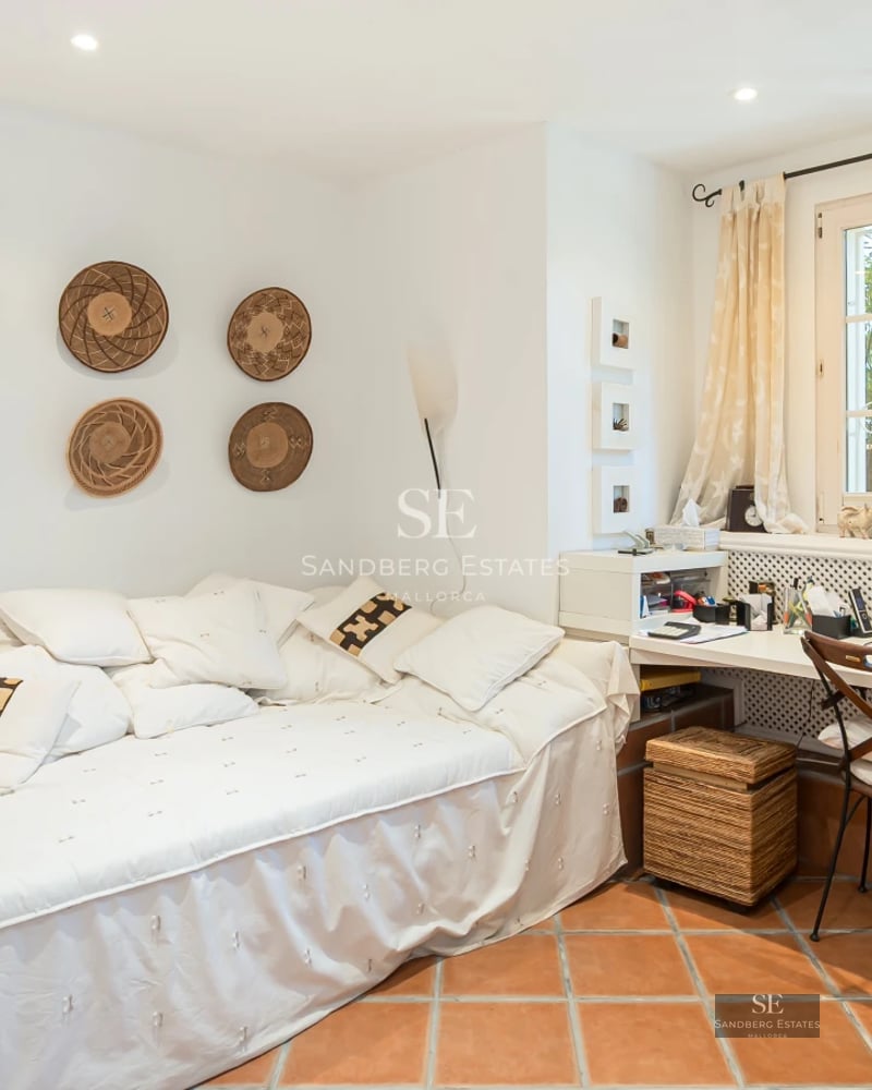 Exterior view of a modern villa featuring an infinity pool, lush garden, and expansive terraces. Minimalist architecture with large windows.