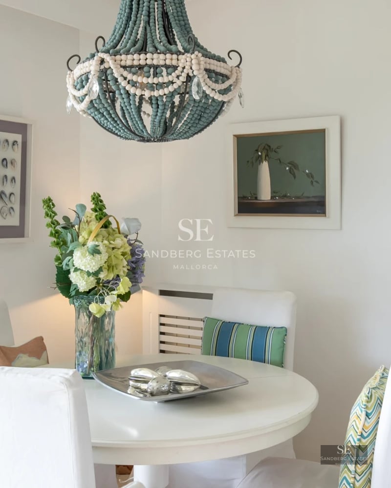 Exterior view of a modern villa with a swimming pool, lush landscaping, and expansive terraces. Minimalist architecture with large windows.