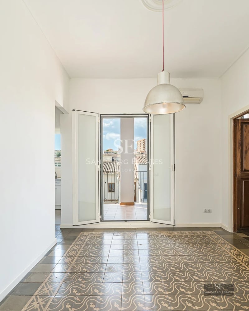 Image of a luxurious reflecting pool with a modern villa in the background, surrounded by lush vegetation.