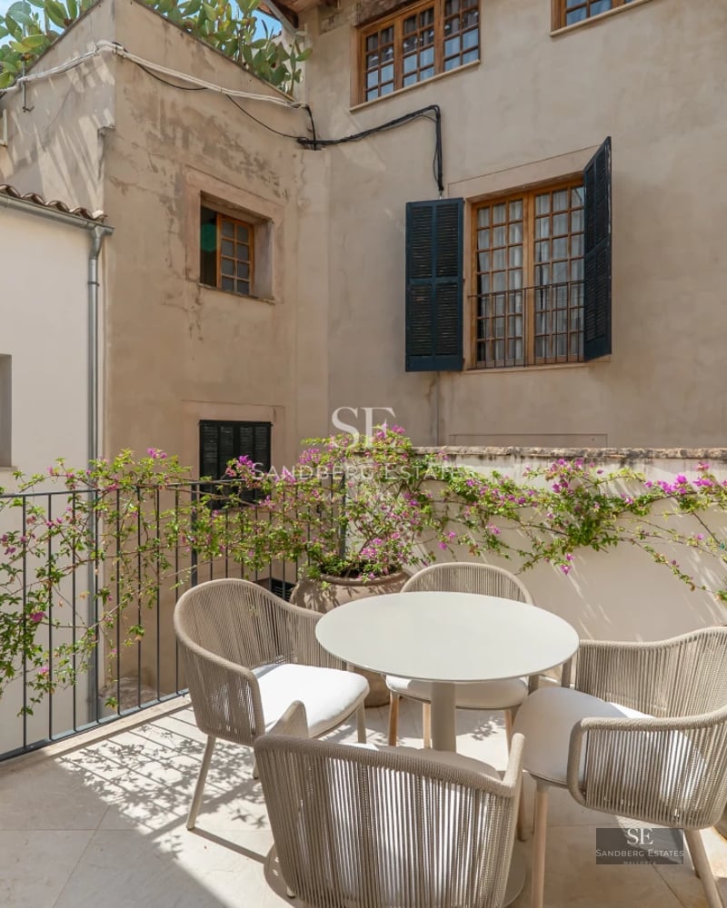 Spacious terrace with infinity pool and panoramic views. Modern, minimalist design with ambient lighting.