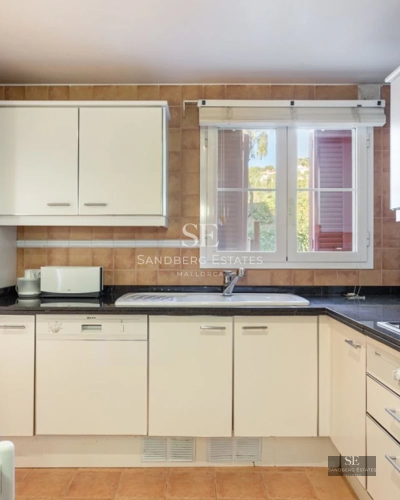 Expansive terrace with an infinity pool and ocean views. Modern design with stylish outdoor furniture and lush greenery.