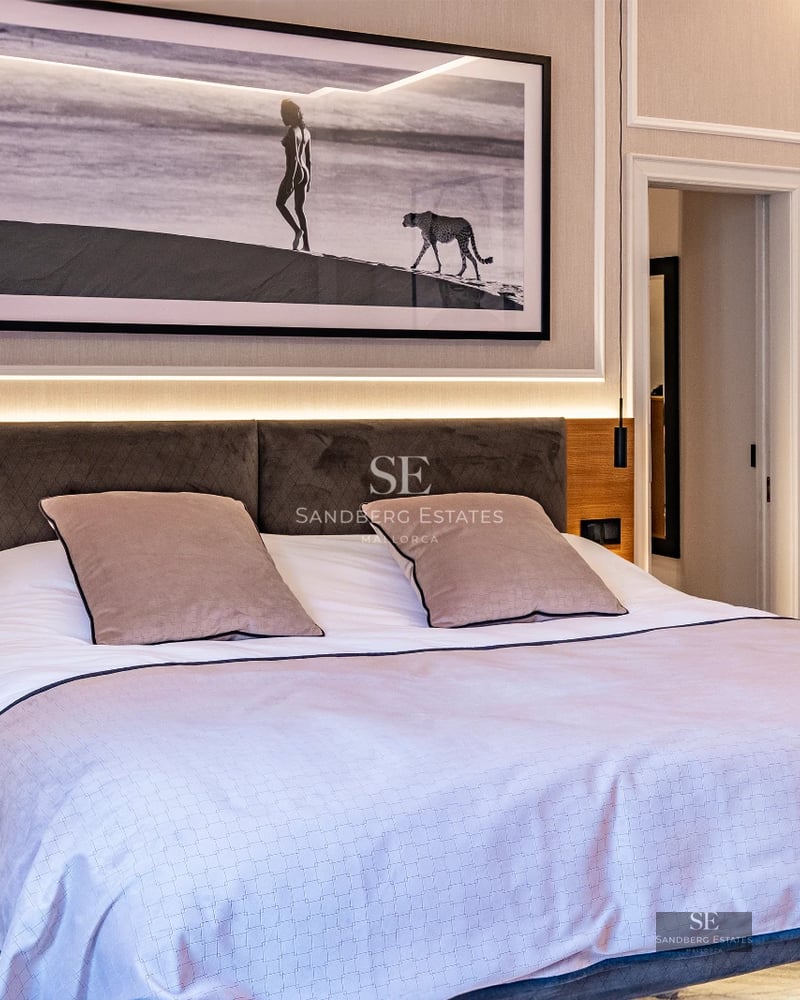 Spacious living room with infinity pool. Large windows, modern design, natural lighting, and neutral color palette.