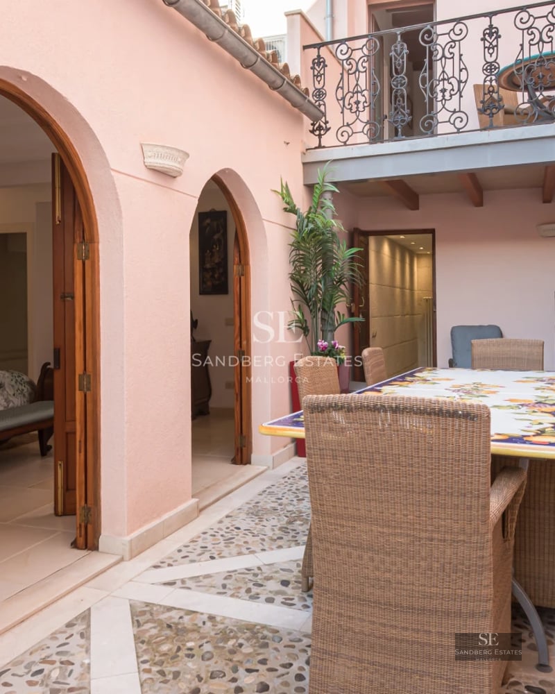 Exterior view of a modern villa with pool, minimalist architecture, large windows and elegant landscaping.