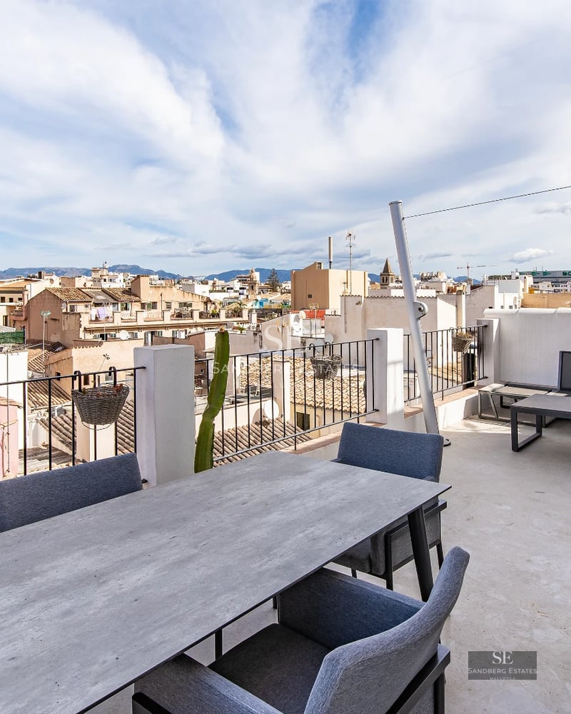 View of a modern villa featuring a swimming pool, sun deck, and lush garden. Minimalist design with high-quality finishes.
