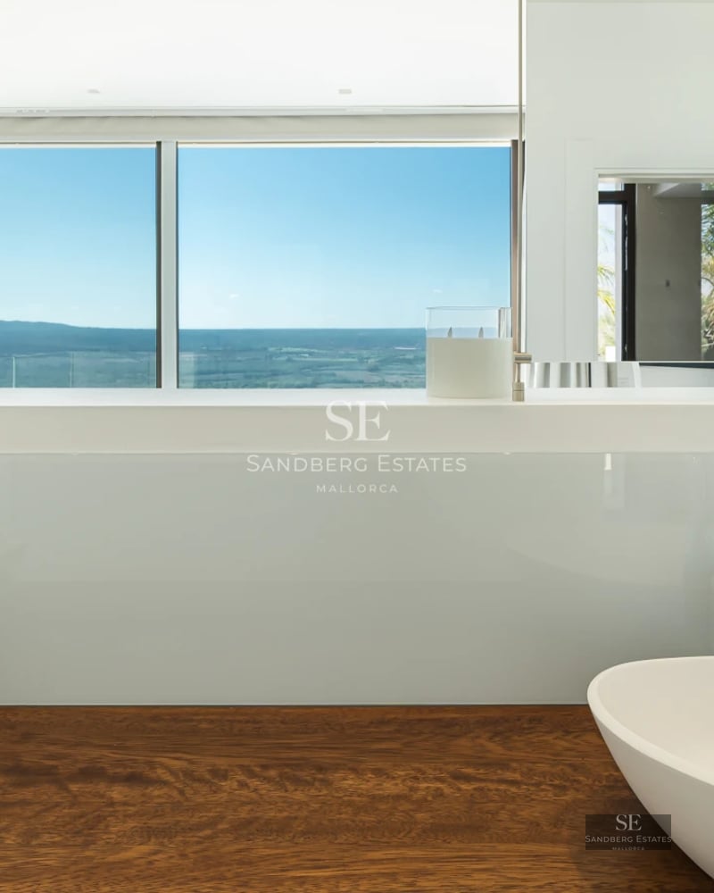 Modern exterior with infinity pool and sea view. Minimalist architecture, clean lines, and spacious terraces. Well-maintained garden.