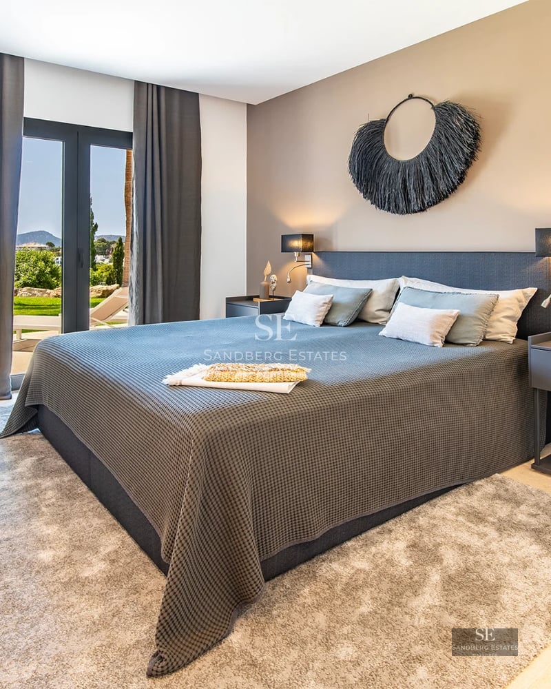 Exterior view of modern villa featuring an infinity pool, large windows, and minimalist design. Lush garden and spacious terrace.