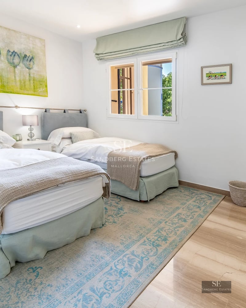Exterior view of modern villa with reflecting pool. Minimalist design, large windows, and lush greenery.