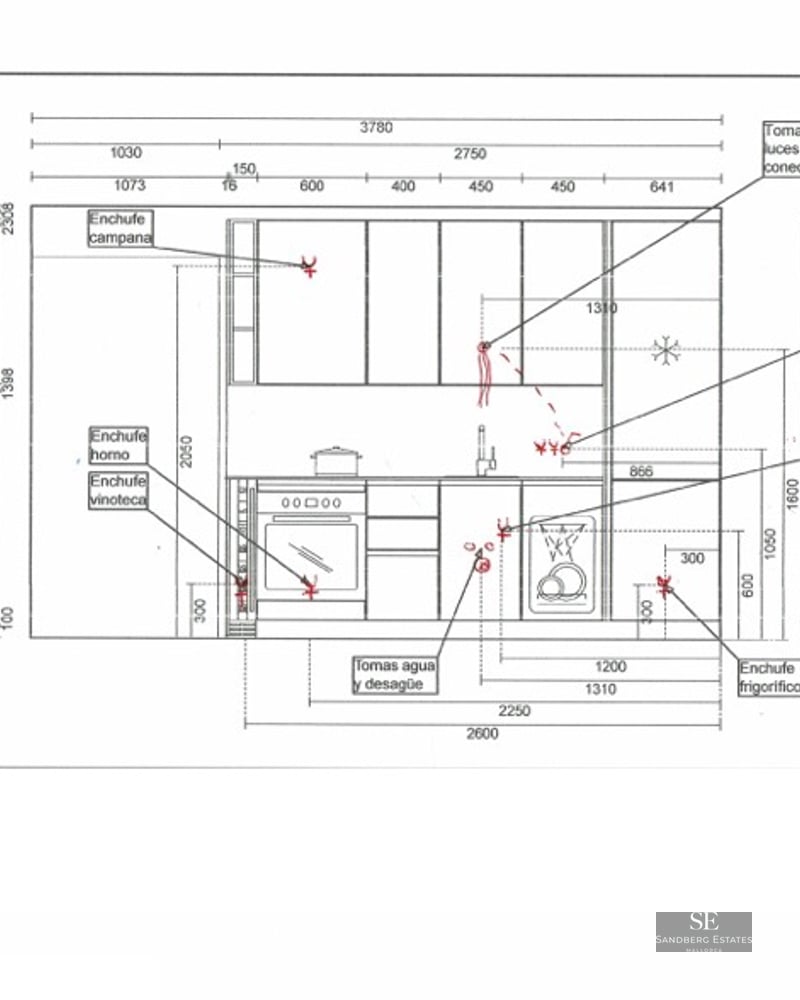 Technical drawing of a kitchen layout with measurements and markings for electrical and plumbing connections.
