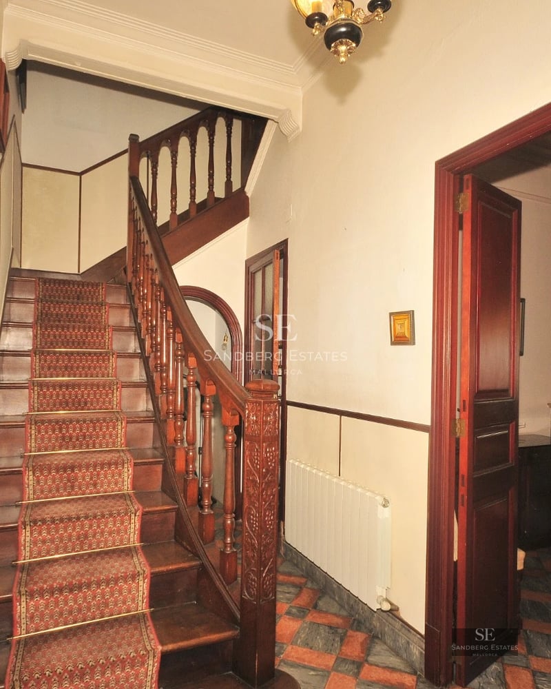 Exterior view of a modern villa with infinity pool, lush garden, and spacious terraces. Minimalist architecture with large window fronts.