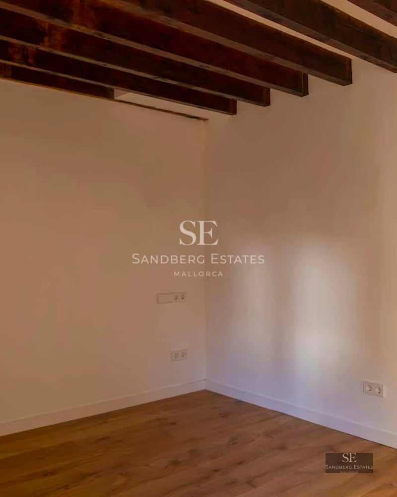 Bright interior with sea view. Large windows, light wood floors, modern furniture and minimalist details. Elegance and comfort.