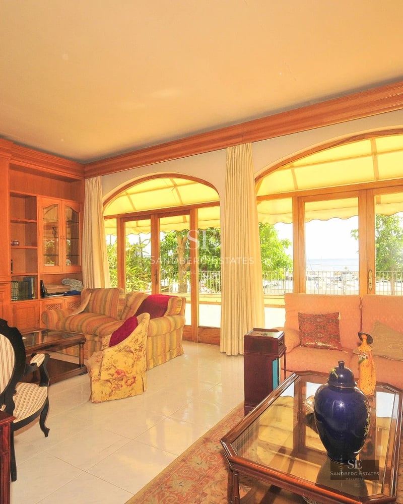 Contemporary villa with reflecting pool, large windows, and lush garden. Minimalist and elegant design with ambient lighting.