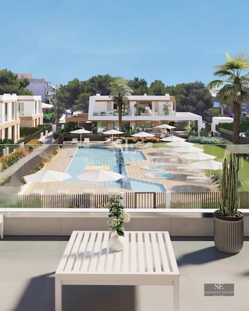 View of a modern villa featuring a pool, garden, and terraces. Minimalist architecture with large windows and stone detailing.