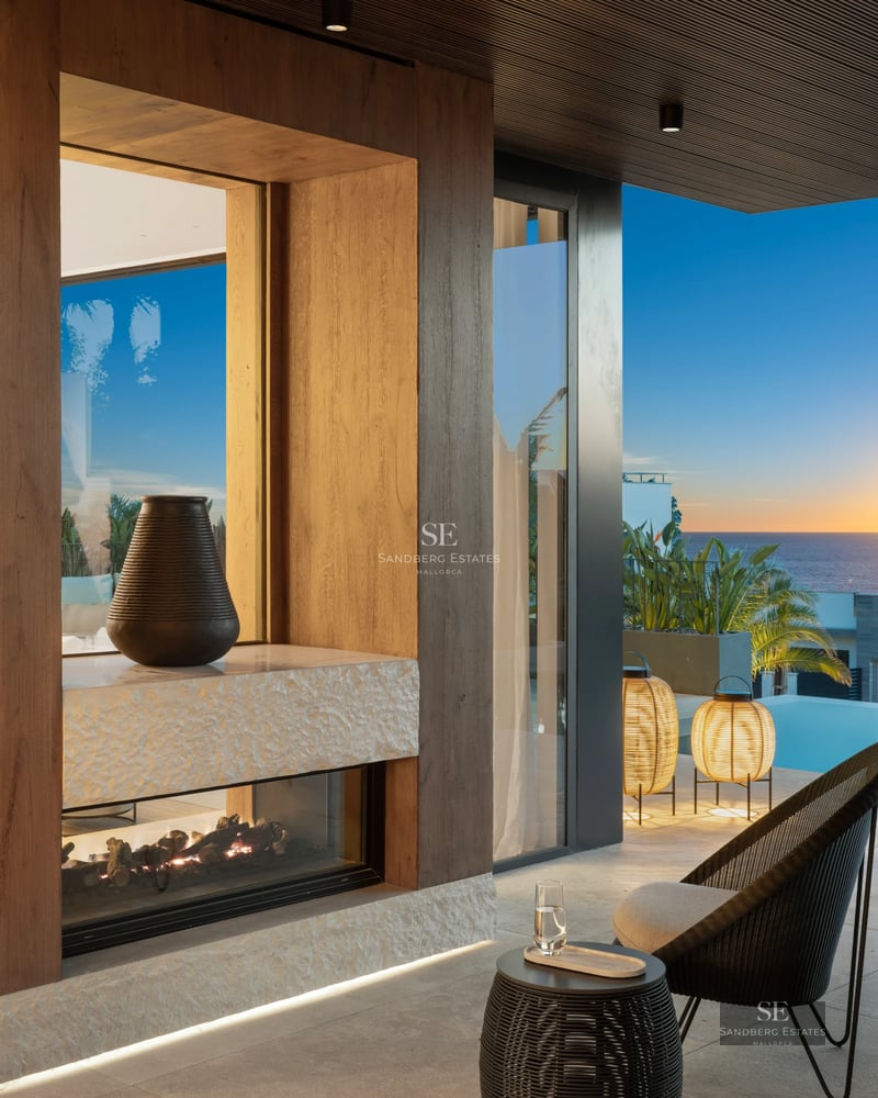 Exterior view of a modern villa featuring a pool, landscaped gardens, and spacious terraces. Contemporary architectural design with high-quality finishes.