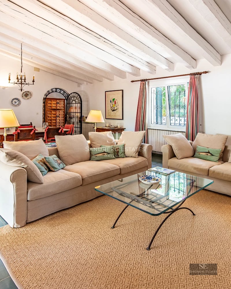 View of infinity pool and terrace with modern furniture. Minimalist architecture, large windows, and unobstructed views.