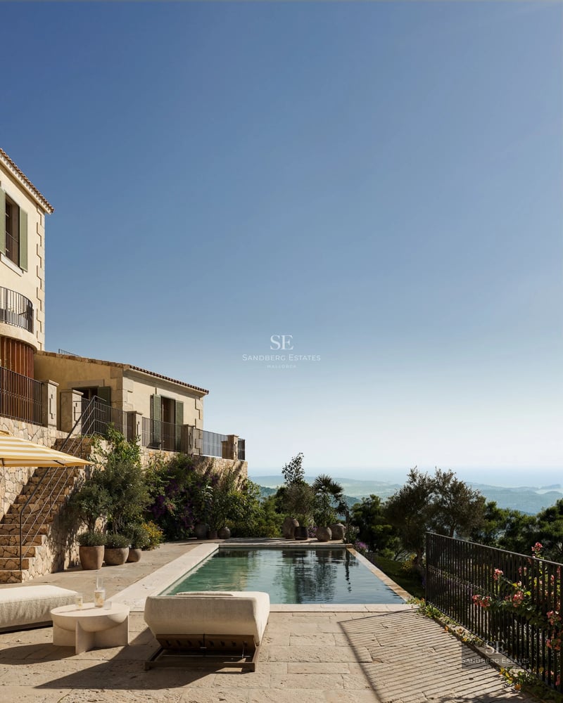 Exterior view of a modern villa featuring a pool, lush gardens, and expansive terraces. Minimalist and elegant design.