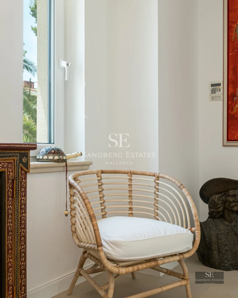 Expansive view with balcony, pool, sea in background. Modern design, natural light, neutral colors. Luxury finishes and contemporary style.