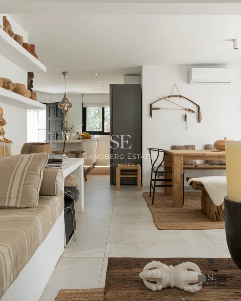 View of modern facade with pool, lush garden, and minimalist architecture with large windows.