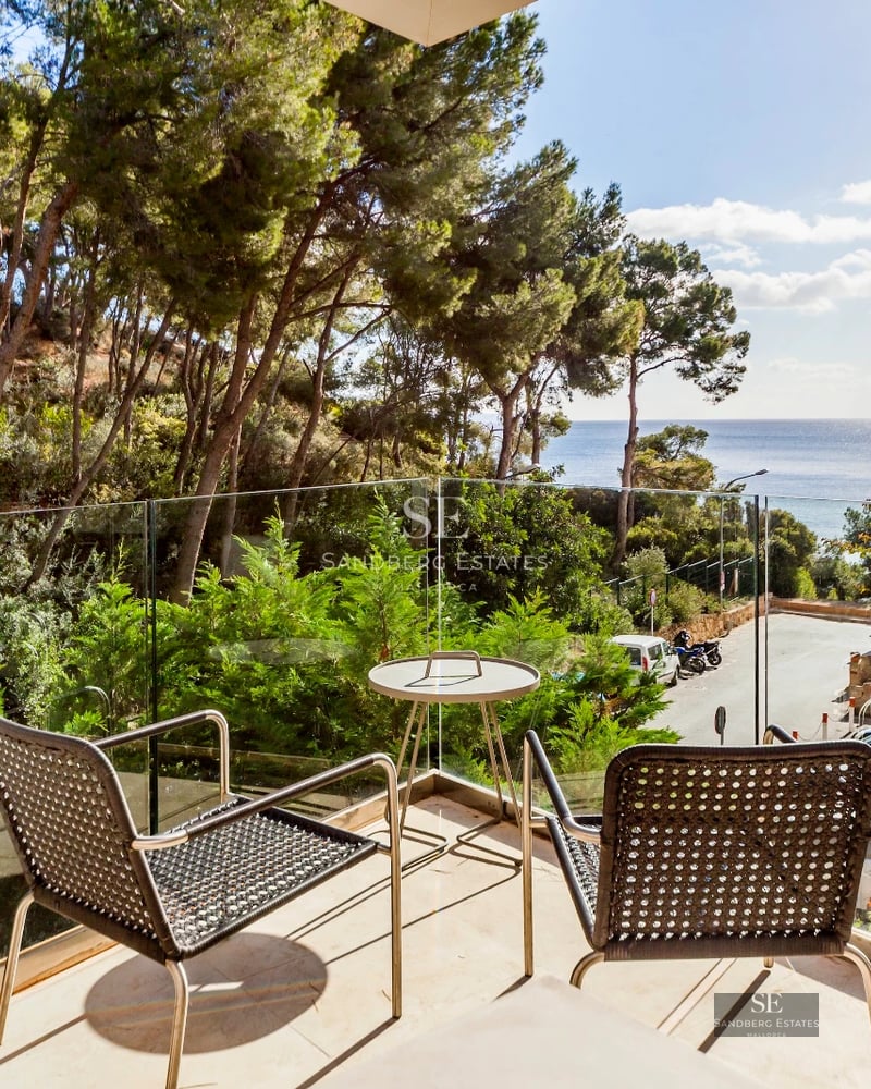 Spacious terrace with infinity pool, sea views. Modern design, elegant outdoor furniture and abundant natural light.