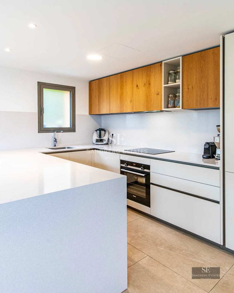 Exterior view of a modern villa with an infinity pool, lush garden, and large terrace. Minimalist architectural design with panoramic windows.