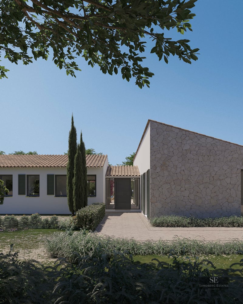 Exterior view of a luxury Mediterranean villa with stone walls, white plaster, green shutters, and lush landscaping.
