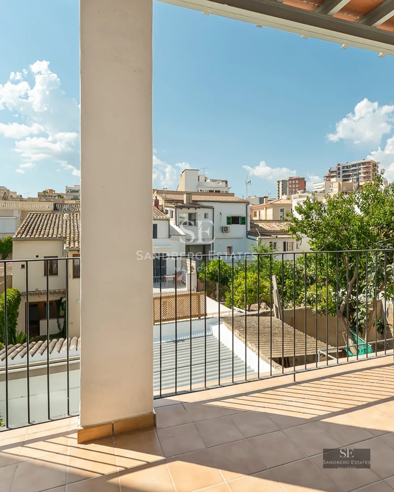 Modern villa exterior featuring a pool, lush garden, and expansive terraces. Minimalist design and abundant natural light.