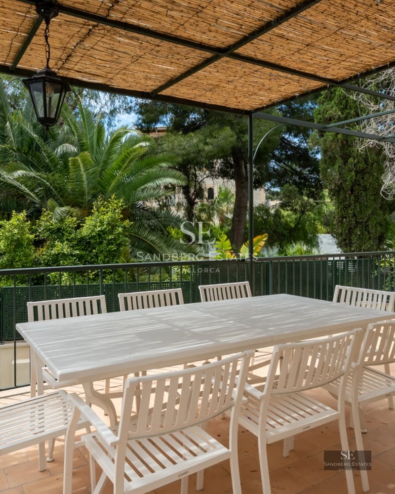 Spacious balcony with sea view. Glass railing, modern and elegant furniture. High-quality finishes and minimalist design.