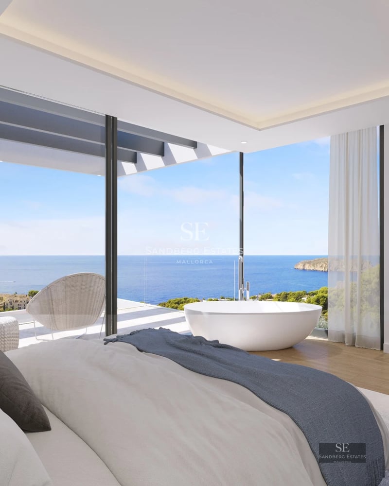 Spacious balcony with ocean view. Modern design, glass railing. Ideal for relaxing and enjoying the seascape.