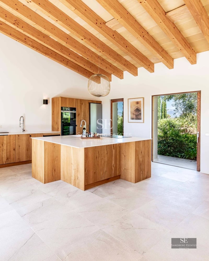 Spacious balcony with panoramic sea views. Modern design with outdoor furniture and glass railing.