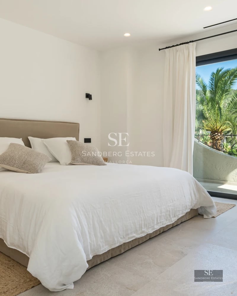 Exterior view of a modern villa with a pool, manicured garden, and large windows. Minimalist and elegant architecture.