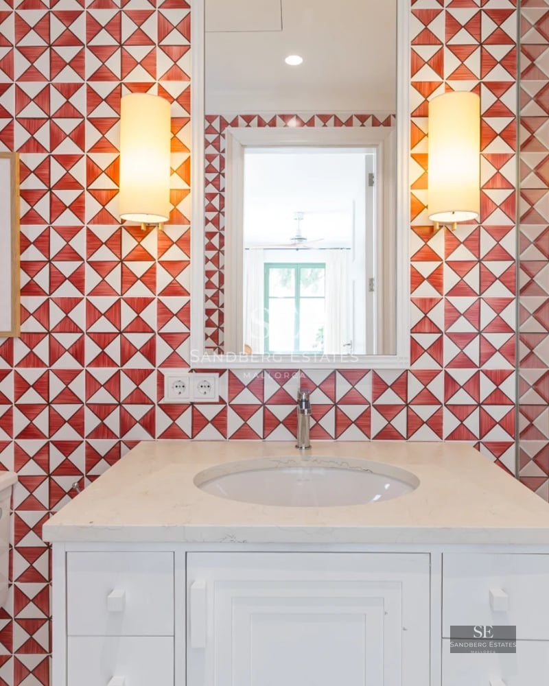 Spacious balcony with panoramic sea views. Stylish outdoor furniture and light wood flooring. Modern and bright design.