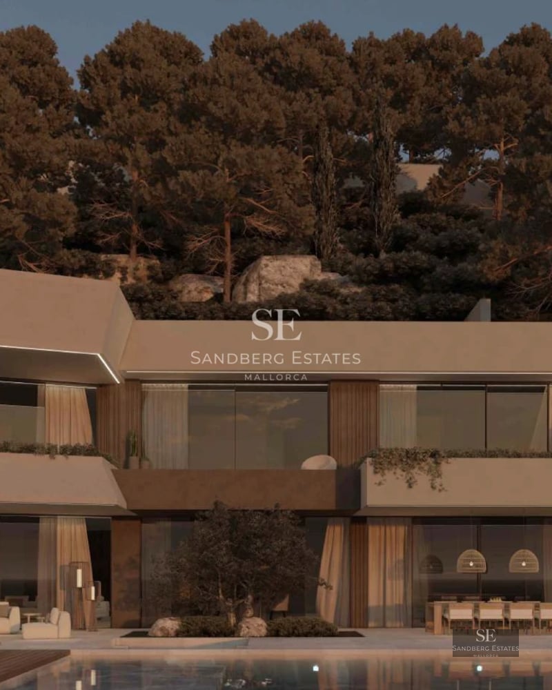 Spacious balcony overlooking the sea, modern outdoor furniture, glass railing and wooden flooring.