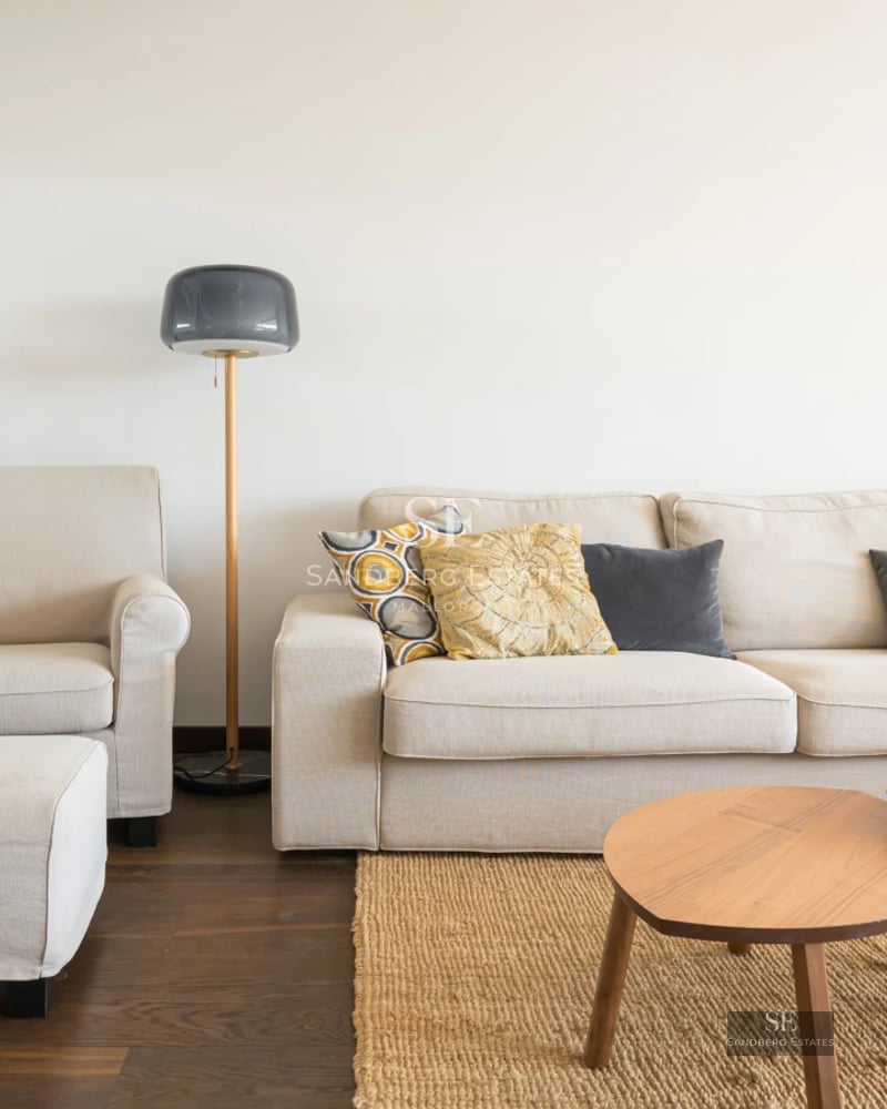 Expansive terrace with pool, lounge chairs, and panoramic views. Modern design with clean lines and high-quality materials. Lush vegetation.