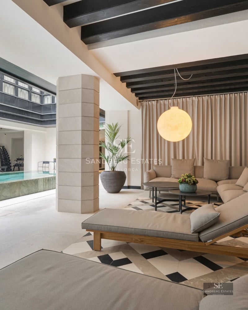 Expansive terrace featuring an infinity pool, ocean views, and modern furniture. Minimalist design with luxury finishes.