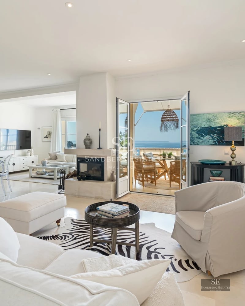 Villa view with infinity pool, manicured lawn, and modern architecture with large windows. Sleek and contemporary design.